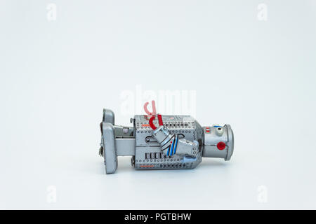 Robot laying on back, space above for copy Stock Photo