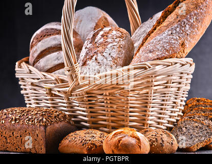 Composition with assorted bakery products in wicker basket Stock Photo