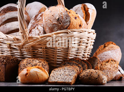 Composition with assorted bakery products in wicker basket Stock Photo