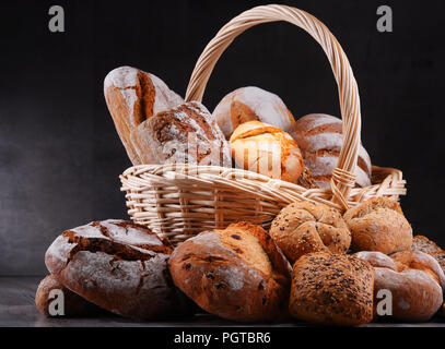 Composition with assorted bakery products in wicker basket Stock Photo