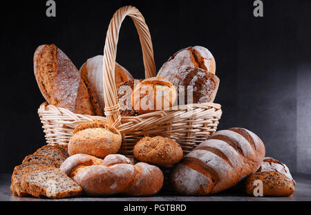 Composition with assorted bakery products in wicker basket Stock Photo