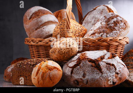 Composition with assorted bakery products in wicker basket Stock Photo
