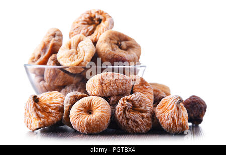Composition with bowl of dried figs isolated on white Stock Photo