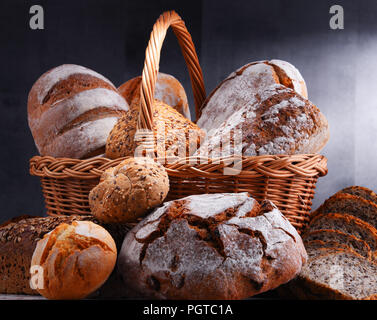Composition with assorted bakery products in wicker basket Stock Photo