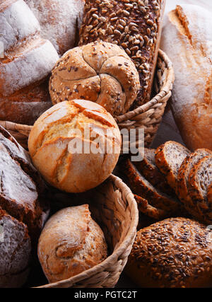 Composition with assorted bakery products in wicker basket Stock Photo