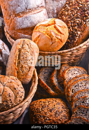Composition with assorted bakery products in wicker basket Stock Photo