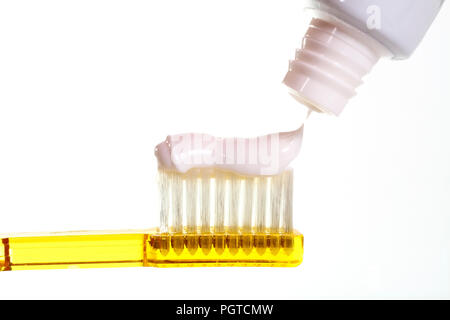 Close up of a toothbrush with toothpaste isolated on a white background with space for copy Stock Photo