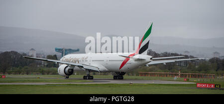 Emirates Boeing 777 Dubai flight seen at Glasgow International Airport, Renfrewshire, Scotland. Stock Photo