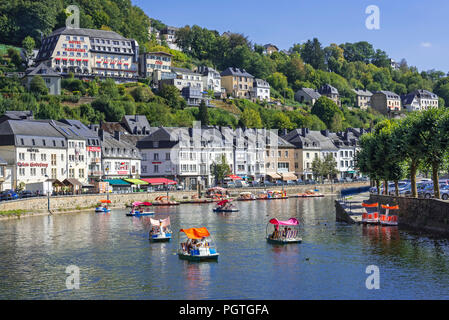 Paddle boats with tourists on the Semois river in the city Bouillon in summer, Luxembourg Province, Belgian Ardennes, Belgium Stock Photo