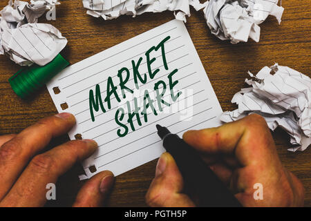 Conceptual hand writing showing Market Share. Business photo text The portion of a market controlled by a particular company Man holding marker notebo Stock Photo