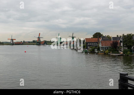 Authentic Zaandam mills on the water channel in Zaanstad village. Zaanse Schans Windmills and famous Netherlands canals, Europe. Stock Photo