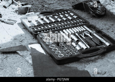 A set of socket keys in a box, a black and white photo. Concept of bike repair. Stock Photo