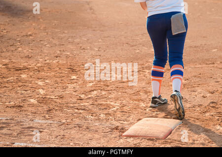Player stand on home plate in a baseball (softball) dusty field, with copyspace Stock Photo