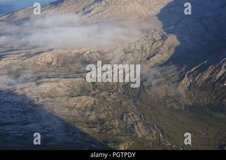 Meandering Burn Stream along the Valley Floor Under Slight Cloud Inversion. Birds Eye View from Meall a'Ghiubhais Mountain. Kinlochewe, Torridon, UK. Stock Photo