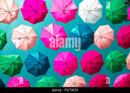 Multicolored floating umbrellas against the blue sky. Saint-Petersburg, Russia. Stock Photo