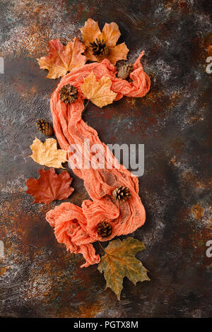 Autumn leaves and pine cones on dark background. Flat lay, top view, copy space Stock Photo