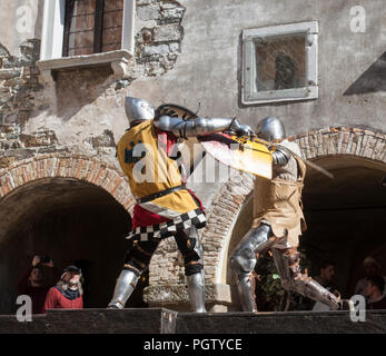 Battle of the knights on the castle yard at the medieval festival 'Al cospetto dei Conti di Gorizia 2018' Stock Photo