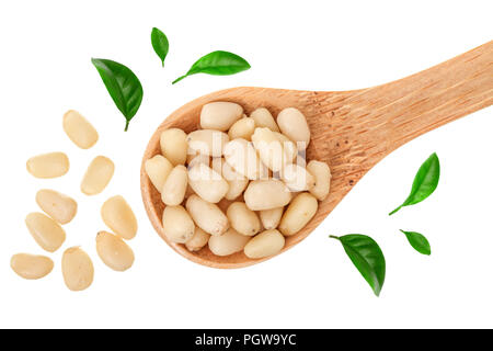 Shelled cedar pine nuts in wooden spoon isolated on white background. Top view. Flat lay Stock Photo