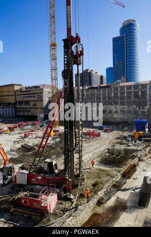 Global project of urban re-development: drilling machine at work on a building site, Part-Dieu district, Lyon, France Stock Photo
