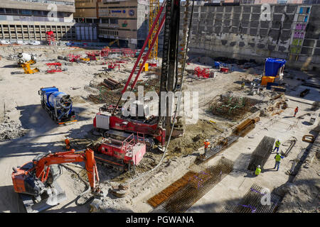 Global project of urban re-development: drilling machine at work on a building site, Part-Dieu district, Lyon, France Stock Photo