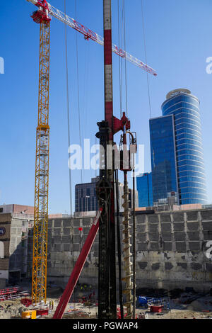 Global project of urban re-development: drilling machine at work on a building site, Part-Dieu district, Lyon, France Stock Photo