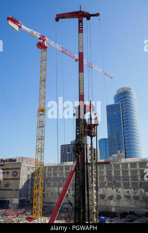 Global project of urban re-development: drilling machine at work on a building site, Part-Dieu district, Lyon, France Stock Photo