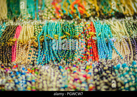 Colorful Bracelets Beads And Necklaces Souvenir For Sale On Street At Khao  San Road Night Market Bangkok Thailand Stock Photo - Download Image Now -  iStock