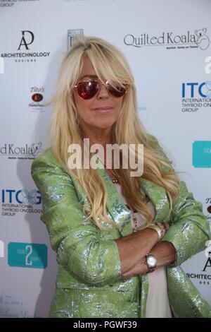 Jill Zarin 6th Annual Luxury Luncheon at Topping Rose House in Bridgehampton, NY  Featuring: Dina Lohan Where: Bridgehampton, New York, United States When: 28 Jul 2018 Credit: IZZY/WENN.com Stock Photo