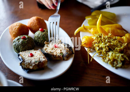 Georgian pkhali with spinach, eggplant, and pickle vegetables at restaurant in Tbilisi, Georgia Stock Photo