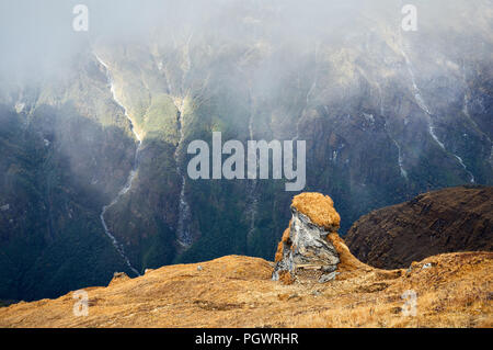 Landscape of Rocks and Waterfalls at foggy day in Himalaya Mountains in Nepal Stock Photo