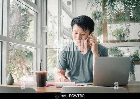 Freelancer man working online at his home. Stock Photo