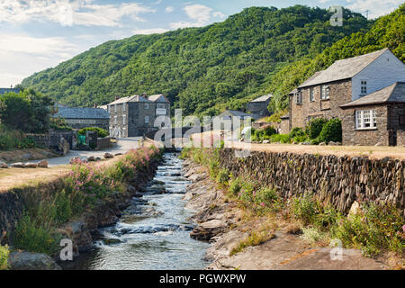 2 July 2018: Boscastle, North Cornwall, UK - the coastal village of Boscastle, with cottages and the River Valency running through it with a slate str Stock Photo