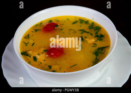 Fish soup with salmon and tomato - Uha Stock Photo