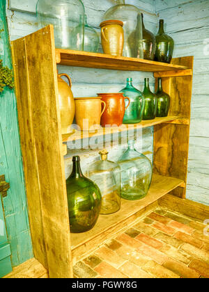 Old colorful jugs on a shelf in open-air museum (Spreewaldmuseum) in Lehde, Germany Stock Photo