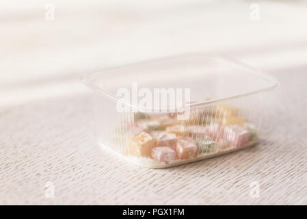 Rahat lukum in the Bank stands on a white table. the view from the top. Stock Photo