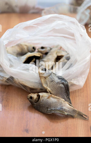salted dried fish is in the package. the next 2 fish . close up Stock Photo