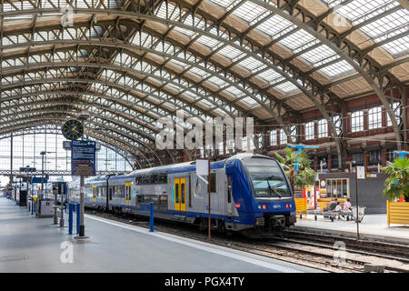 Platforms and travellers at Gare de Lille Flanders railway station, Lille, France Stock Photo