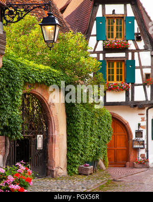 Village street scene in Kaysersberg along the wine route, Alsace Haut-Rhin France Stock Photo