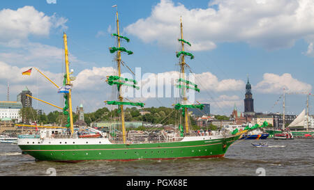 Historic sailing ship on the river Elbe in front of St. Pauli Piers, Port of Hamburg, behind St. Michaelis Michel church Stock Photo