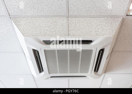 Ceiling mounted large air-conditioner in office, close up view Stock Photo
