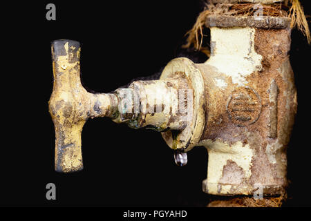 Leaking valve, scale, fur on the rusty pipe.  Leakage. Stock Photo