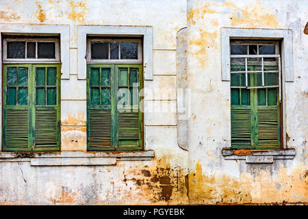 Facade and windows of damaged old houses with colorful details in the historical city of Ouro Preto in Minas Gerais. Stock Photo