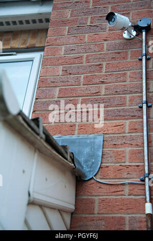 swann security camera fitted to the front of a brick built house Stock Photo