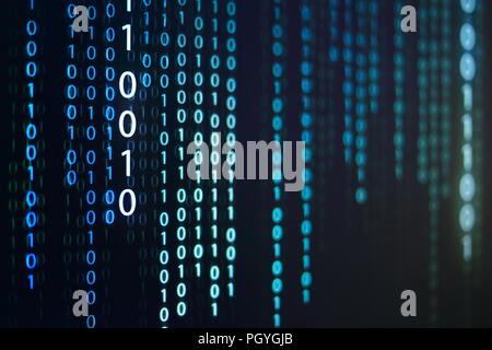 computer data matrix. vertical digital binary code moving motion downward. light up blue one and zero text flowing down. black background space with m Stock Photo