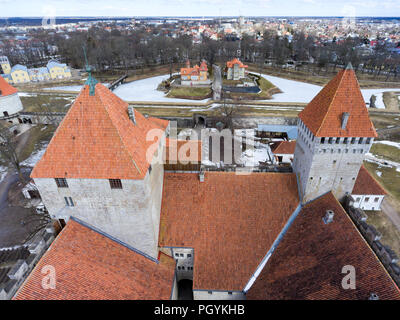 Kuressaare Fortress and guest houses on moat. Spring. Medieval fortification in Saaremaa island, Estonia, Europe. Aerial view Stock Photo