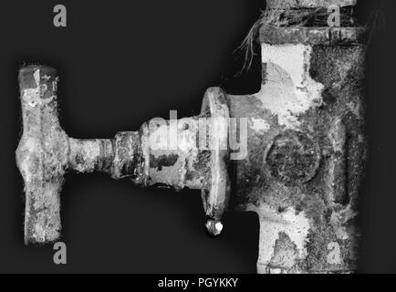 Leaking valve, scale, fur on the rusty pipe.  Leakage. Stock Photo