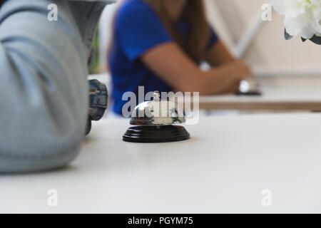 Bell on a white table Stock Photo