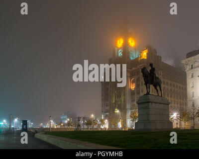Liverpool, England, UK - November 1, 2015: The iconic Royal Liver Building is shrouded in fog on a winter night. Stock Photo