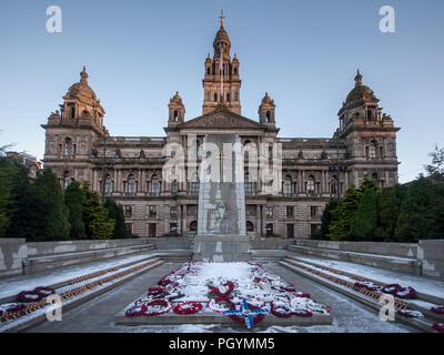 Glasgow, Scotland, UK - January 9, 2011: Winter snow lies in front of the Cenotaph in George Square, in front of Glasgow City Chambers. Stock Photo