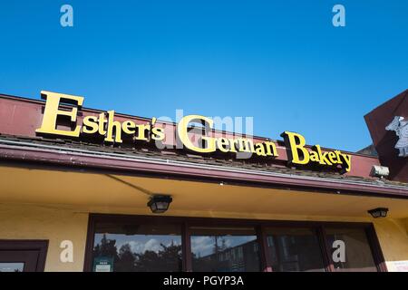 Sign on facade of Esther's German Bakery, a German cuisine restaurant and bakery which is popular among technology workers and is known for being a favorite of Facebook founder Mark Zuckerberg, in the Silicon Valley, Los Altos, California, May 30, 2018. () Stock Photo